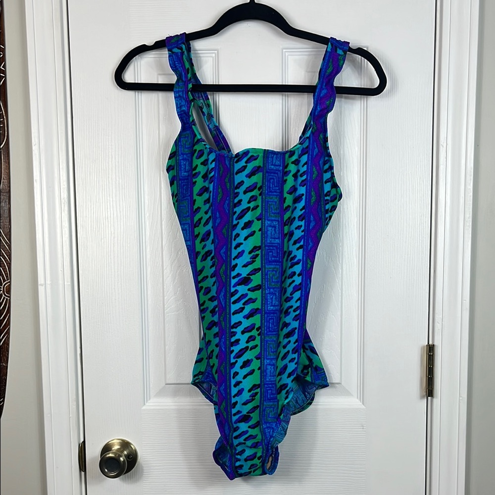 Lands’End multi colored 1 of. Swimsuit size 16. Built in bra, crossed straps.